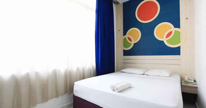 Kamar Tidur Wisma Rainbow Pekanbaru