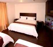 Bedroom 7 Hotel Nusa CT by Holmes Hotel