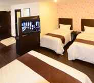 Bedroom 5 Hotel Nusa CT by Holmes Hotel