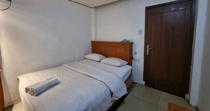 Kamar Tidur OYO 90952 Hotel Grand Sirao