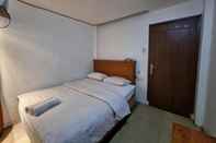 Bedroom OYO 90952 Hotel Grand Sirao
