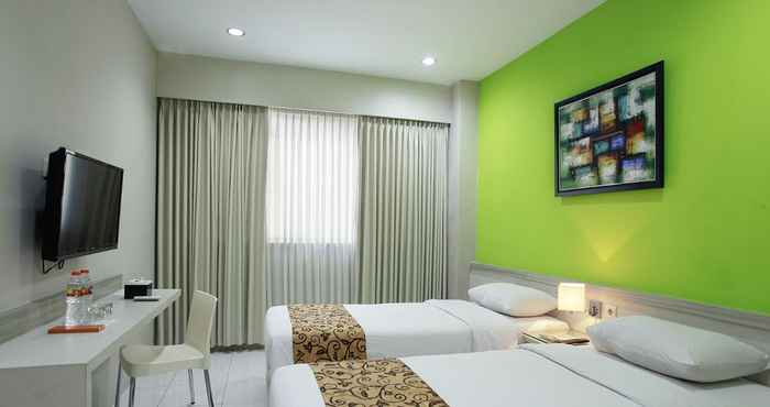 ห้องนอน Rivisha Hotel