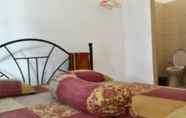 Kamar Tidur 5 DeAL Guest House Syariah