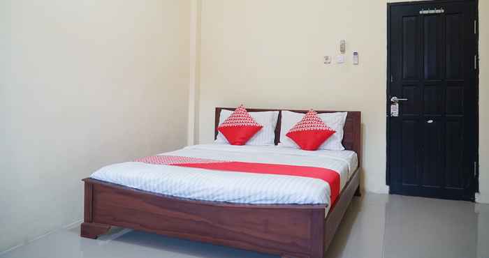 Kamar Tidur OYO 1034 Pondok Mulia Guest House Syariah