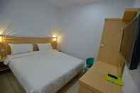 Kamar Tidur T-One Hotel