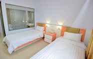 Kamar Tidur 5 T-One Hotel