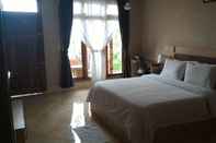 Phòng ngủ Samosir Villa Resort