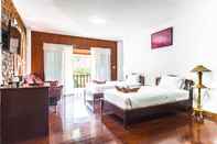 ห้องนอน Raks Thai Resort