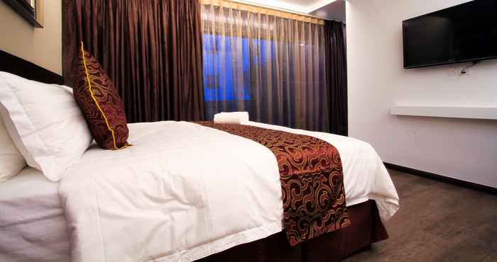 Kamar Tidur J Suites Hotel