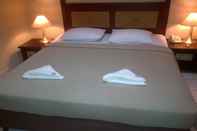 ห้องนอน Central Hotel Manado