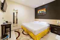 Kamar Tidur One Avenue Hotel