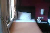 Kamar Tidur The Winner Premier Hotel