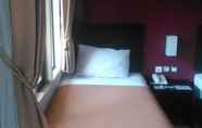 Kamar Tidur 6 The Winner Premier Hotel