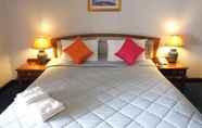 Bedroom 2 Ratchada City Hotel