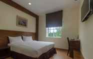 Kamar Tidur 5 Super OYO 596 The Vintage Hotel