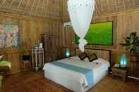 ห้องนอน Puri Taman Sari Resort