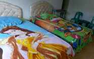 Kamar Tidur 6 Riana Homestay