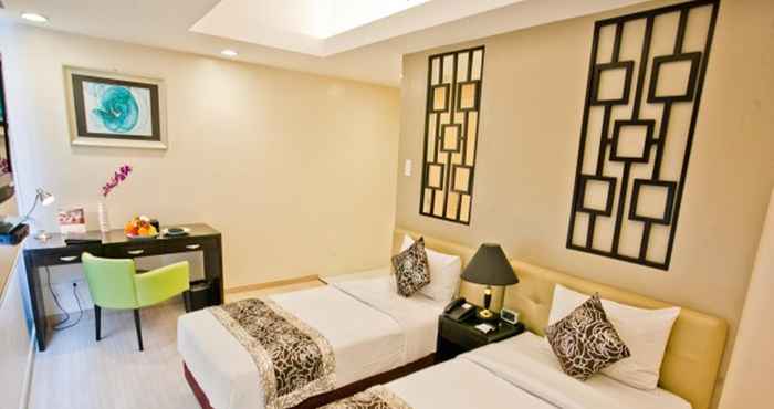 Kamar Tidur The Exchange Regency Residence Hotel Managed by HII