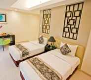 Bedroom 4 The Exchange Regency Residence Hotel Managed by HII