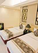 BEDROOM The Exchange Regency Residence Hotel Managed by HII