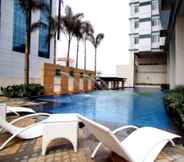 Swimming Pool 5 The Exchange Regency Residence Hotel Managed by HII