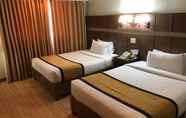 Kamar Tidur 5 The Pinnacle Hotel and Suites