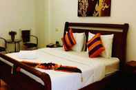 Kamar Tidur WeRest Hotel