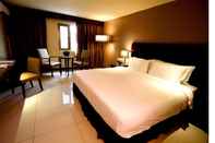 Kamar Tidur Mandarin Plaza Hotel