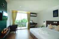 ห้องนอน The Flora May Resort