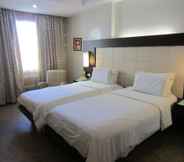 ห้องนอน 2 Circle Inn Hotel and Suites