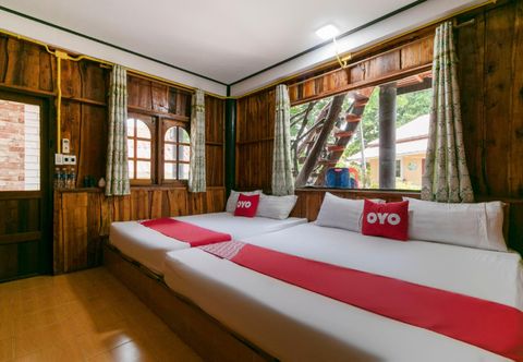 Bedroom OYO 948 Bamboo River Resort