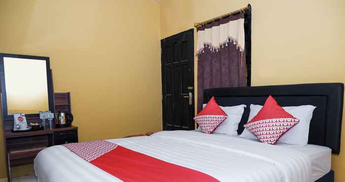Bedroom OYO 598 Udan Mas Guesthouse& Gallery