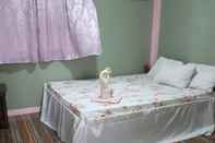 Bedroom Basio's Place Tourist Inn by RedDoorz