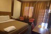 Kamar Tidur Iris House Hotel