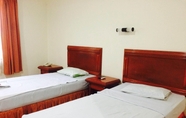 Bedroom 2 Hotel Basana Inn