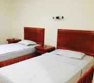 Bedroom 2 Hotel Basana Inn
