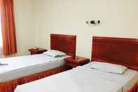Bedroom Hotel Basana Inn
