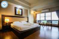 ห้องนอน Madina Hotel Rayong