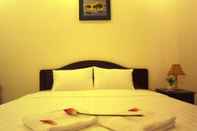 Kamar Tidur Queen Bee Hotel