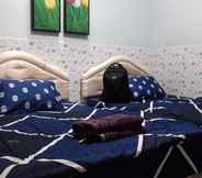 Bedroom 6 Grand Homestay Syariah