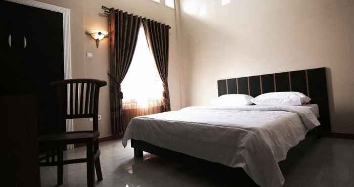 Kamar Tidur Clean Room at Maison 48 Syariah Guesthouse