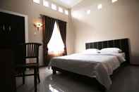 Kamar Tidur Clean Room at Maison 48 Syariah Guesthouse