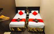 Kamar Tidur 3 Highway Times Inn Hotel