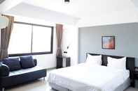 ห้องนอน iZen Budget Hotel & Residence 