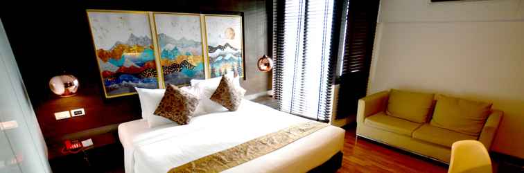 Bedroom i Residence Hotel Silom