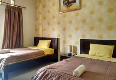 Bedroom 3 Cozy Rooms near Jalan Kaliurang at Guest House Arjuna Syariah
