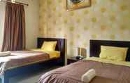 Bedroom 4 Cozy Rooms near Jalan Kaliurang at Guest House Arjuna Syariah