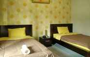 Bedroom 3 Cozy Rooms near Jalan Kaliurang at Guest House Arjuna Syariah