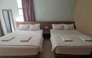 Bilik Tidur 2 Super OYO 89930 Golden Guest House