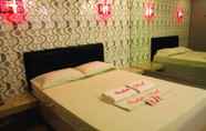 Kamar Tidur 5 Orchids Drive Inn Hotel and Restaurant
